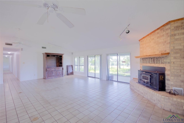 7876 Green Hills Rd, Gilmer, TX 75645 - unfurnished living room featuring ceiling fan, light tile patterned floors, lofted ceiling, and track lighting