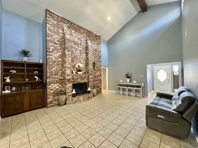 tiled living room with beam ceiling, a brick fireplace, and high vaulted ceiling