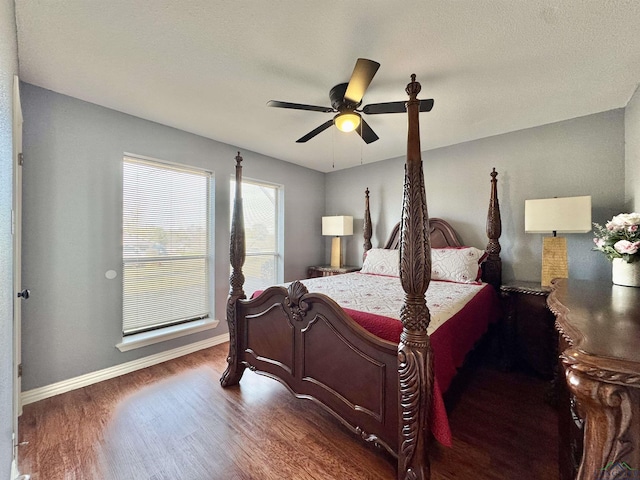 bedroom featuring dark hardwood / wood-style flooring and ceiling fan