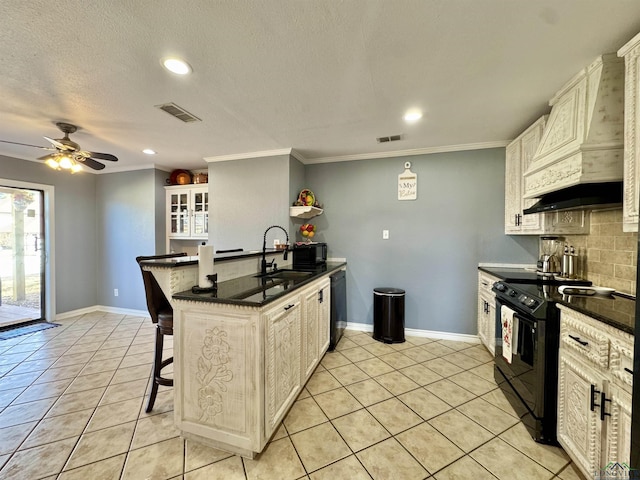 kitchen featuring kitchen peninsula, black appliances, decorative backsplash, a breakfast bar area, and light tile patterned flooring