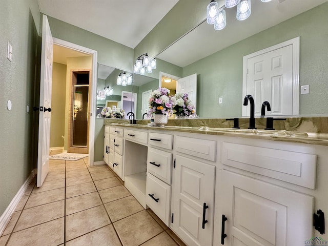 bathroom featuring vanity, tile patterned floors, and a shower with shower door