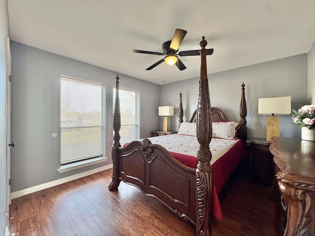 100 Bretta Cir, Longview, TX 75605 - bedroom featuring wood finished floors, baseboards, and a ceiling fan