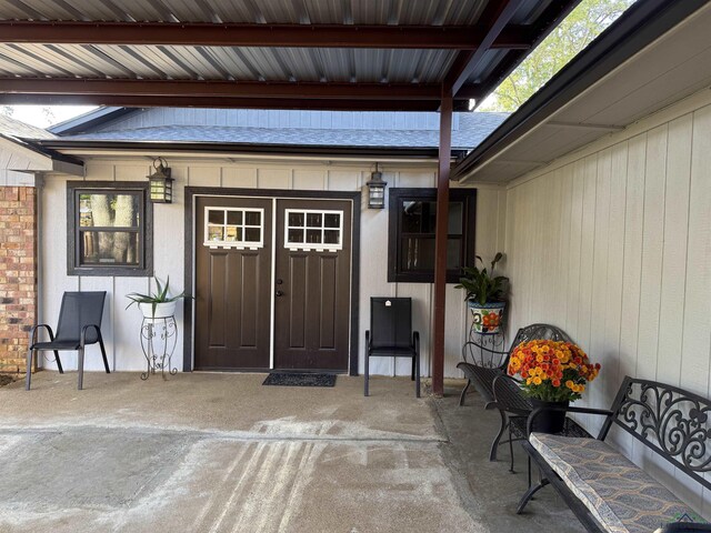 100 Bretta Cir, Longview, TX 75605 - rear view of property with a chimney, brick siding, and a patio area