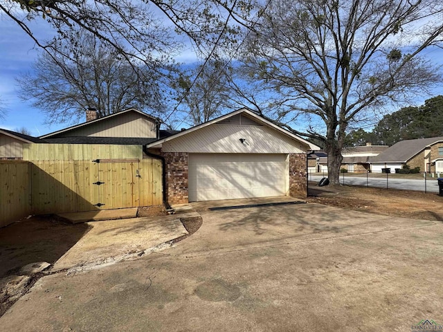 view of side of home with a garage