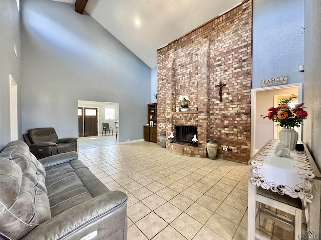 living room featuring a brick fireplace, high vaulted ceiling, light tile patterned floors, and beamed ceiling