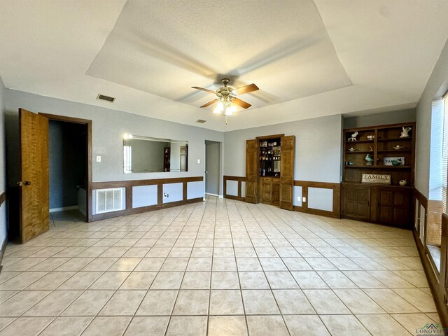 100 Bretta Cir, Longview, TX 75605 - bathroom with tile patterned floors, a ceiling fan, vaulted ceiling, a textured ceiling, and curtained shower