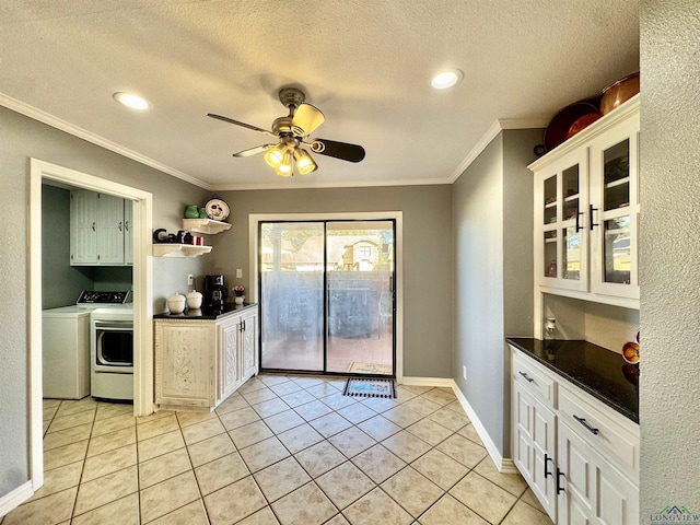 kitchen featuring separate washer and dryer, light tile patterned floors, ceiling fan, a textured ceiling, and white cabinets