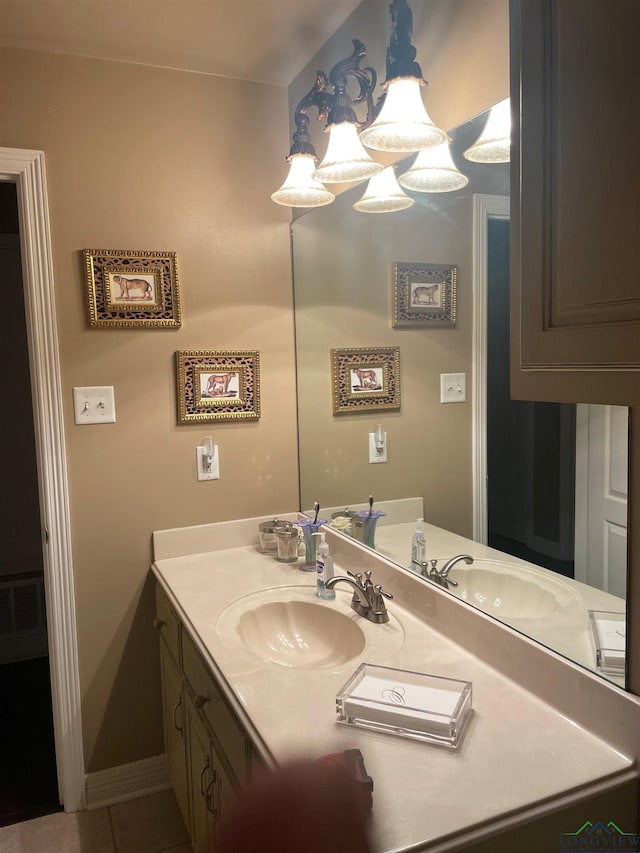 bathroom with vanity, visible vents, and tile patterned floors