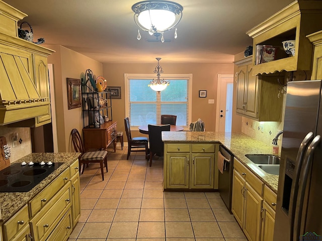 kitchen featuring light tile patterned floors, stainless steel appliances, tasteful backsplash, a sink, and a peninsula