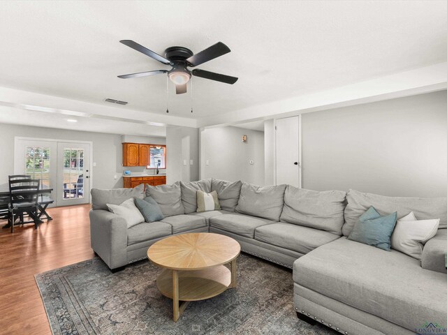 514 N St, Gilmer, TX 75644 - living area featuring wood finished floors and a ceiling fan