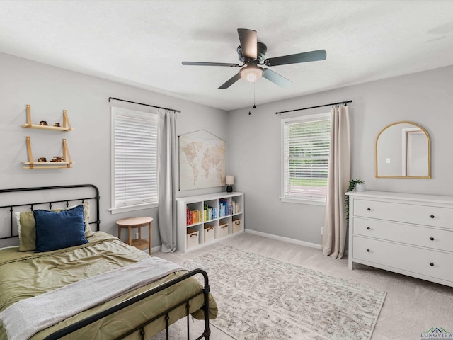 514 N St, Gilmer, TX 75644 - bedroom with light carpet and a ceiling fan