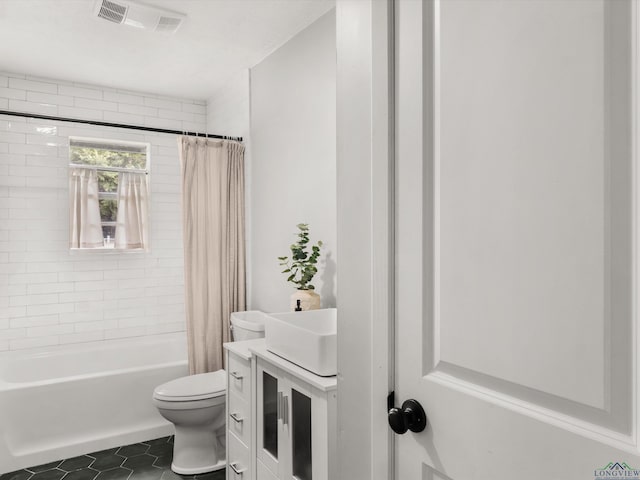 514 N St, Gilmer, TX 75644 - bathroom with tile patterned floors, shower / bath combo, and vanity