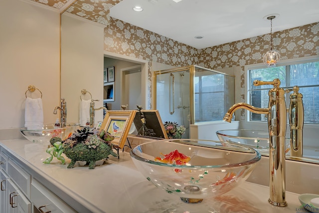 bathroom featuring vanity and an enclosed shower