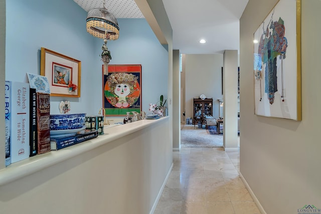 hallway featuring light tile patterned floors