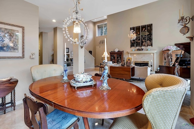 dining room with light tile patterned flooring and an inviting chandelier