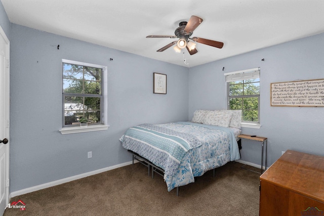 bedroom featuring baseboards, a ceiling fan, and carpet floors