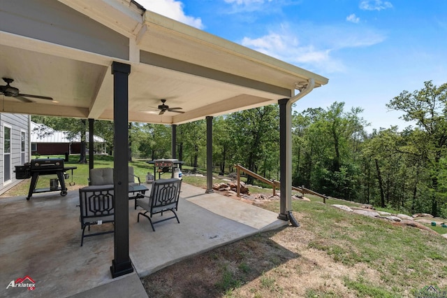 view of patio with ceiling fan, outdoor dining space, and area for grilling