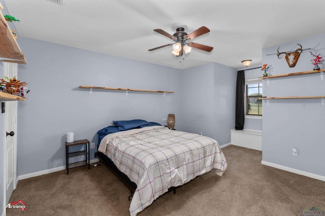 bedroom featuring baseboards, ceiling fan, and carpet