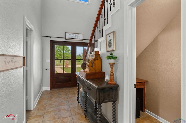 doorway to outside with baseboards