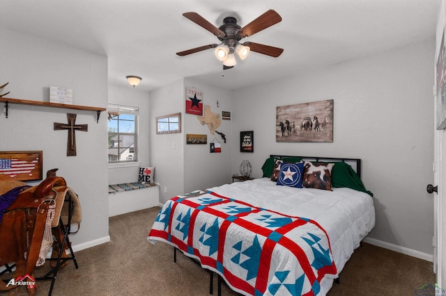 carpeted bedroom featuring baseboards and a ceiling fan