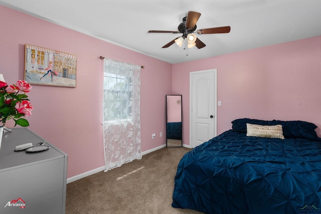 bedroom with carpet floors, baseboards, and a ceiling fan