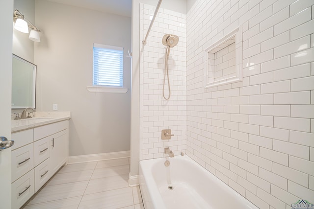 bathroom featuring baseboards, vanity, and shower / tub combination