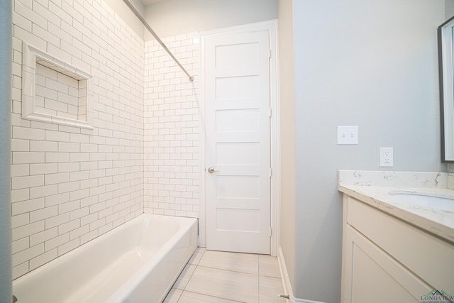 full bathroom featuring shower / tub combination, tile patterned flooring, vanity, and baseboards