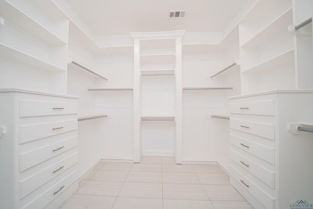 spacious closet with light tile patterned flooring and visible vents