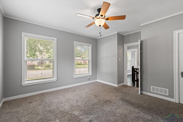 513 E Young, Longview, TX 75602 - unfurnished bedroom with crown molding, carpet, baseboards, and a ceiling fan