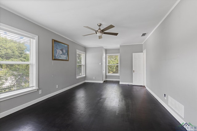 513 E Young, Longview, TX 75602 - unfurnished room featuring dark wood-style flooring, a ceiling fan, ornamental molding, and baseboards