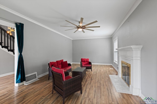 513 E Young, Longview, TX 75602 - living area with ceiling fan, wood finished floors, stairs, baseboards, and ornamental molding