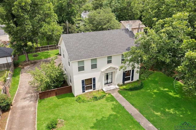 513 E Young, Longview, TX 75602 - colonial home featuring a shingled roof and stucco siding