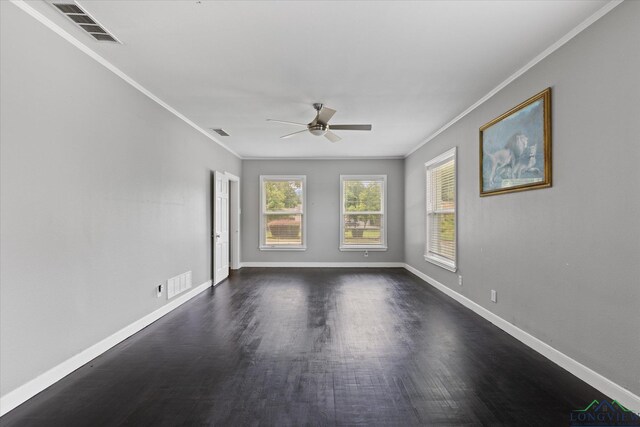 513 E Young, Longview, TX 75602 - empty room with crown molding, ceiling fan, dark wood-style flooring, and baseboards