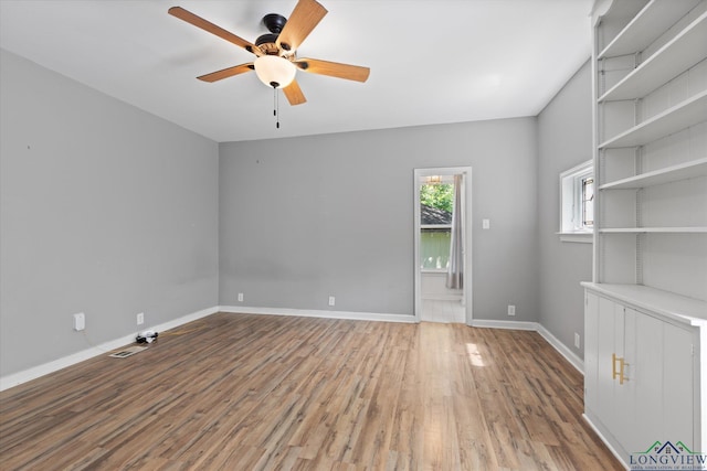 513 E Young, Longview, TX 75602 - spare room featuring a ceiling fan, wood finished floors, and baseboards
