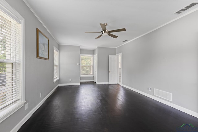 513 E Young, Longview, TX 75602 - spare room with ceiling fan, dark wood-style flooring, ornamental molding, and baseboards