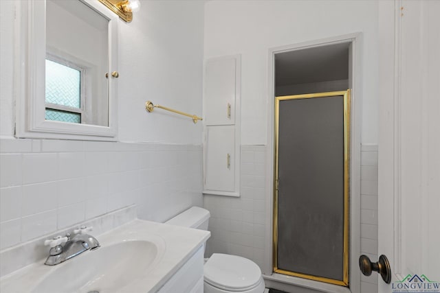 513 E Young, Longview, TX 75602 - full bath with tile walls, a stall shower, toilet, and vanity