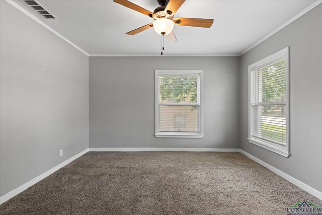 513 E Young, Longview, TX 75602 - carpeted empty room featuring ornamental molding, healthy amount of natural light, ceiling fan, and baseboards