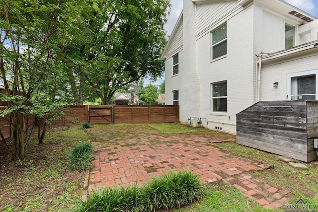 513 E Young, Longview, TX 75602 - rear view of property with a gate and a patio area