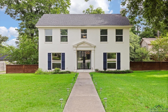 513 E Young, Longview, TX 75602 - colonial inspired home featuring brick siding and a shingled roof