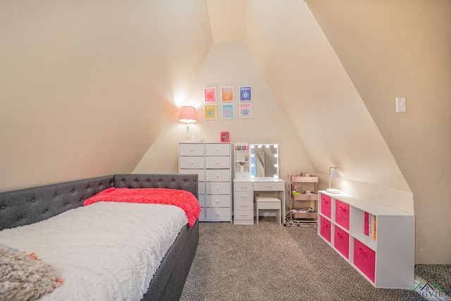 carpeted bedroom with lofted ceiling