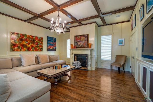 living area featuring a fireplace with raised hearth, dark wood finished floors, coffered ceiling, a decorative wall, and beam ceiling