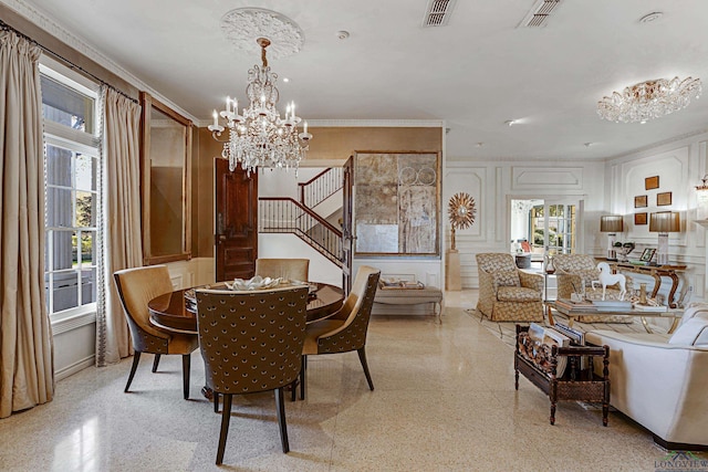 dining area featuring stairs, visible vents, and light speckled floor