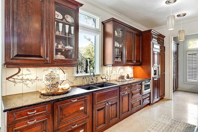 bar featuring baseboards, hanging light fixtures, crown molding, granite finish floor, and a sink