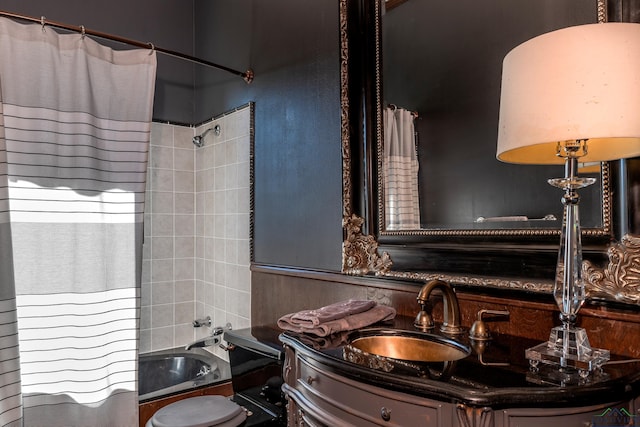 full bathroom featuring vanity and shower / bath combo with shower curtain