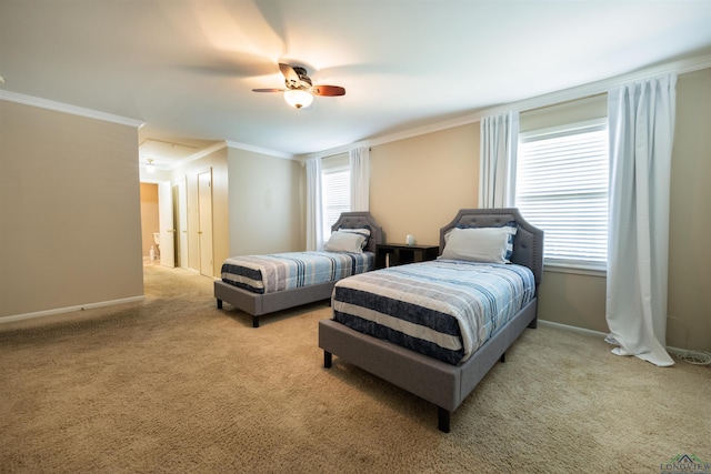 bedroom with multiple windows, light carpet, and ceiling fan