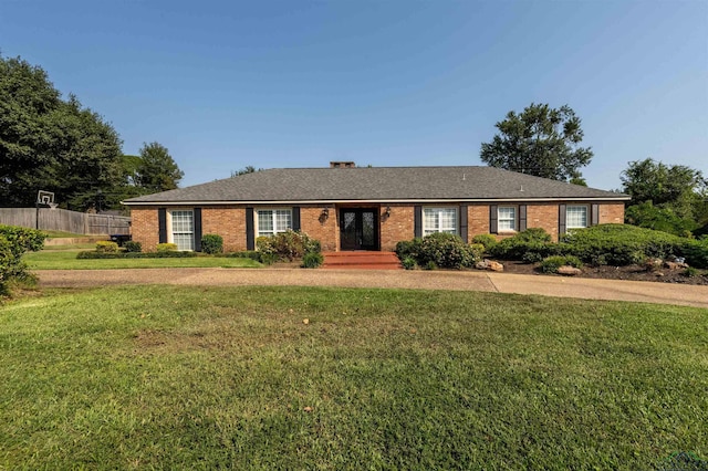 ranch-style house with a front lawn