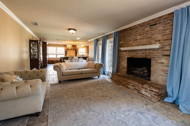 living room featuring crown molding, a fireplace, and a textured ceiling