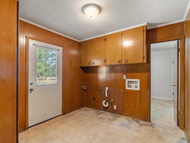 washroom featuring cabinets, washer hookup, ornamental molding, wooden walls, and hookup for a gas dryer