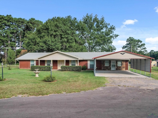 single story home with a front lawn and a carport