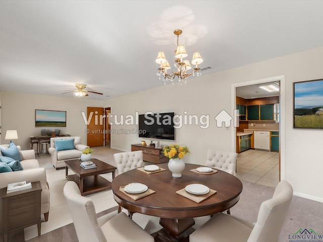 tiled dining space featuring ceiling fan with notable chandelier